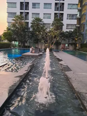 a dog fountain in the middle of a swimming pool at MRT SaiMa D condo monthly rent in Ban Sai Ma