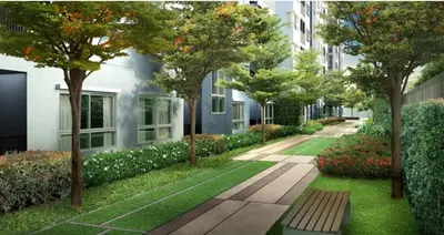 a park with a bench and trees and buildings at MRT SaiMa D condo monthly rent in Ban Sai Ma