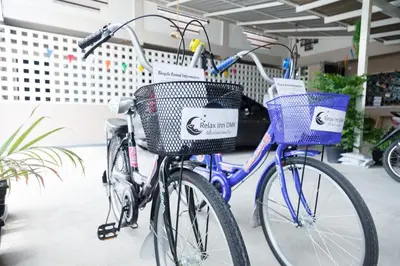 two bikes parked next to each other with baskets at Relax Inn DMK in Lak Si