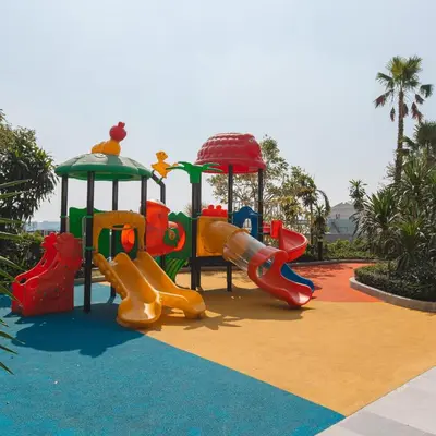 a childrens playground with slides and a slideintend at Beautiful Studio Room Near MRT in Bangkok