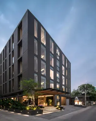 an external view of a black office building at Norma Hotel Sathorn in Bangkok