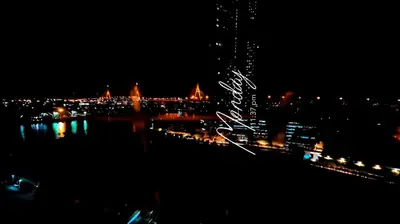 a view of a city at night with lights at River View 8 in Yan Nawa
