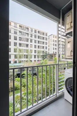 a balcony with a view of a building at 1BR Apt - Pool, Gym, Rooftop, BTS, Coworking Space - 10 min Nana Plaza - Central - New Building - 24 7 Security in Bangkok