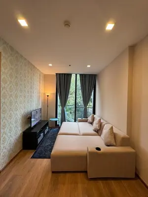 a large bedroom with two beds and a television at Phrom Phong Top 1BD pool,gym,park and mall BTS in Khlong Toei