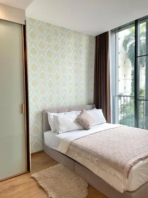 a bedroom with a large bed and a window at Phrom Phong Top 1BD pool,gym,park and mall BTS in Khlong Toei