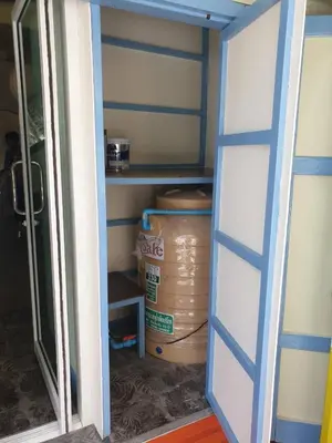 a pantry with a door open and a box at BaanBaan - Cozy home 5pax, 5min BTS, Boat, old town explore in Bangkok