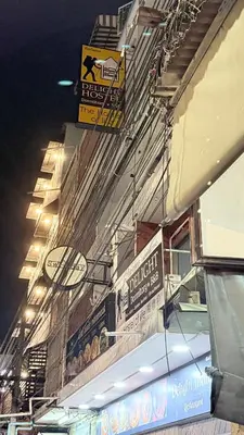 a building with signs on the side of it at Delight Hostel at Khao San in Bangkok
