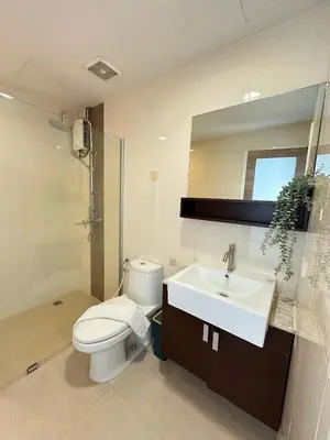 a bathroom with a white toilet and a sink at convenient&peaceful place in Soi nai leot in Bangkok