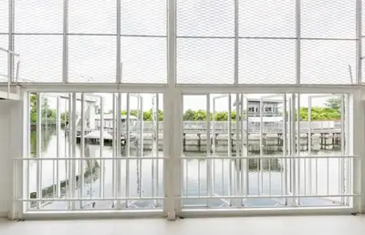 a large window with a view of a marina at Canal Villa on Onnut Road, near Bts Onnut, Bangkok in Amphoe Phra Khanong
