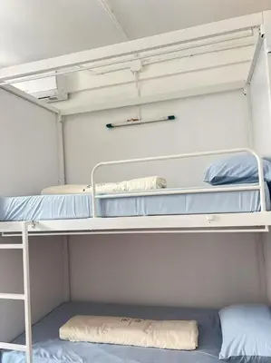 a room with two bunk beds at JC home \u5218 \u5148 \u751f in Bangkok