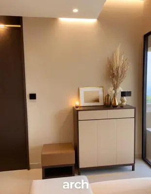 a room with a white cabinet and a table at Comfort Zone in Bangkok