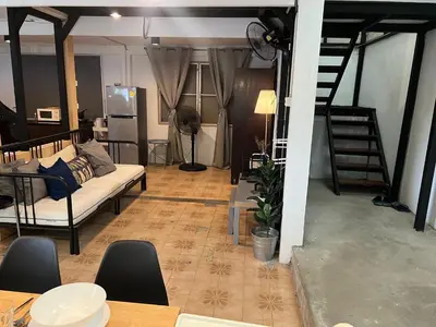a living room with a couch and a table at 3 bedrooms 2 bathroom's in Bang Su