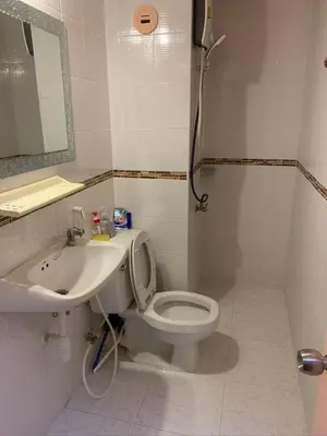 a bathroom with a toilet and a sink at impact เมืองทองธานี ห้องเช่ารายวัน pupular condo T9 C5 C4 C9 T8 in Thung Si Kan