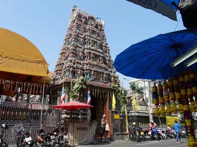 a temple with a large tower in front of it at 24 Apt in Bangkok