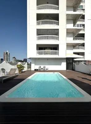 a swimming pool on the roof of a building at Peaceful Cozy Apt with Stunning View&Full Kitchen in Bangkok