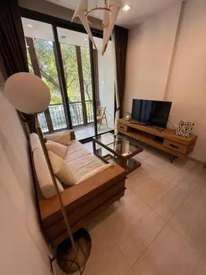 a living room with a couch and a television at City Heaven - Coowork - Gym - BTS - Pool - Mall - Starbucks - ShoppingMall in Bangkok