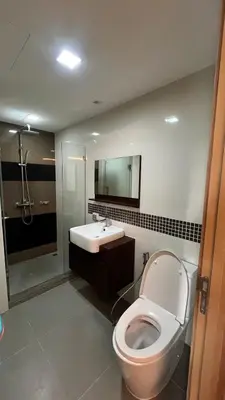 a bathroom with a toilet and a sink at CozyroomSukumvit13walktoBTS,MRT in Bangkok