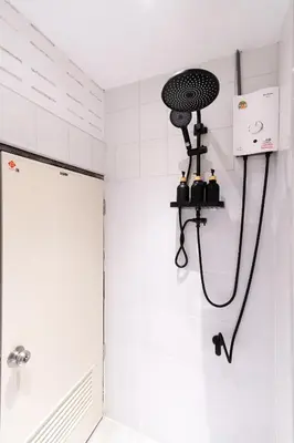 a shower head in a bathroom with a shower at OH Homes - Samsen 10 in Bangkok