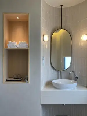a bathroom with a sink and a mirror at Chinatown Heritage, Chinatown Main road in Samphanthawong