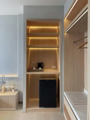 a walk in closet with a black refrigerator in it at Chinatown Heritage, Chinatown Main road in Samphanthawong