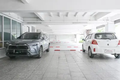 two cars parked in a parking garage at AC Habitat Bangkok in Bangkok