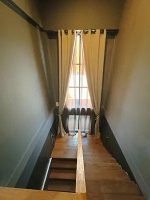 a room with a window and a stairway with curtains at Bangkok Thailand Core Business District 3b3b Duplex Private House Family Room Cooking Smoking Nursery in Bangkok