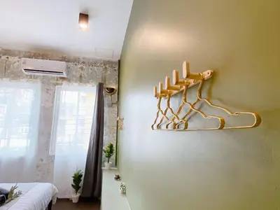 a room with a shelf on the wall at Entire house,Unwind in the city, near GrandPalace in Bangkok