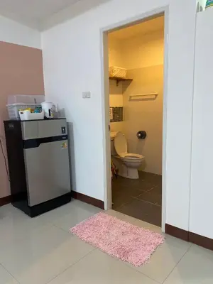 a small bathroom with a toilet and a sink at La Maison 230 in Ban Khlong Samrong