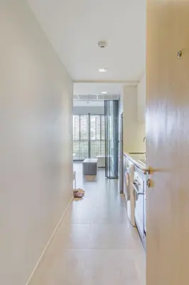 an open hallway with a kitchen and a living room at 2 Bedrooms, Downtown BKK, BTSAsok, Sukhumvit in Bangkok