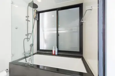a bathroom with a large window and a sink at 2 Bedrooms, Downtown BKK, BTSAsok, Sukhumvit in Bangkok