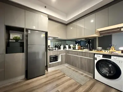 a kitchen with a washer and a dishwasher in it at Expansive Stylish 2BR - Ultra Fast Wifi - Asoke in Bangkok