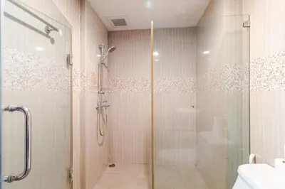 a shower with a glass door in a bathroom at Large room with 2Beds BTS Chitlom Sukhumvit BKK in Bangkok