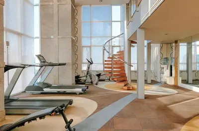 a gym with several exercise equipment in a building at Large room with 2Beds BTS Chitlom Sukhumvit BKK in Bangkok
