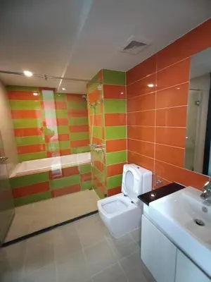a bathroom with a shower and a toilet and a sink at MeStlye BangNa - Baan Win in Bangna