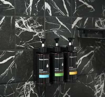 a group of three shampoo bottles sitting on a counter at Cozy 2BR Apt in Central Bangkok 5 mins BTS 110 SQM by MattCo in Bangkok