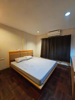 a bedroom with a large bed in a room at Mrchow Nana in Bang Kapi