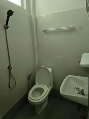 a bathroom with a toilet and a sink at Jatujak Bangkok guesthouse R8 in Sathani Bang Su