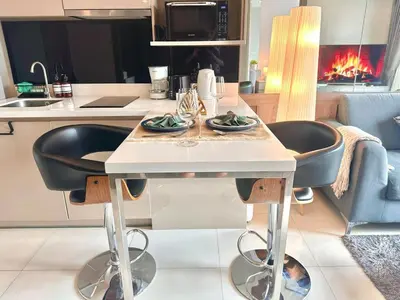 a kitchen with a table with two dishes on it at Luxury & Bright 1 Bedroom - Asoke in Bangkok