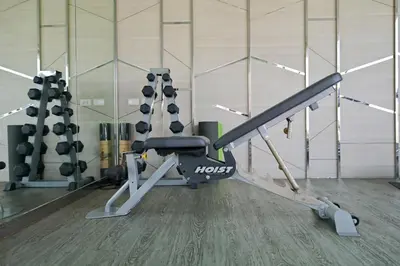 a gym with a treadmill and a squat rack at Luxury & Bright 1 Bedroom - Asoke in Bangkok