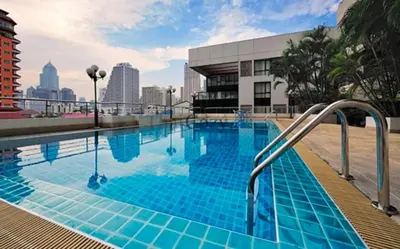 a swimming pool with blue tiles on a building at High Floor Great View 2BR 2BA 3 mins to Nana BTS in Bangkok