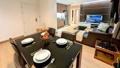 a living room with a black table and a couch at High Floor Great View 2BR 2BA 3 mins to Nana BTS in Bangkok