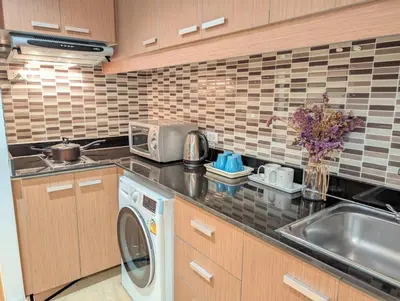 a kitchen with a sink and a washing machine at High Floor Great View 2BR 2BA 3 mins to Nana BTS in Bangkok