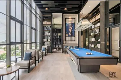 a billiard room with a pool table and chairs at Luxury condo in Bangkok,NearBTSMochit,MRTChatuchak in Bangkok