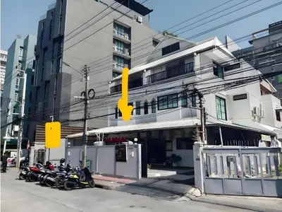 a group of motorcycles parked in front of a building at XX Yellow Place Sukhumvit Soi 2 - BTS Nana in Bangkok
