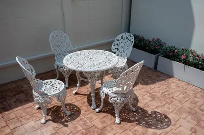 a table and four chairs sitting next to each other at Morya House in Bangkok