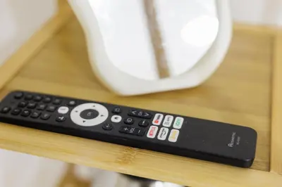 a remote control sitting on top of a table at A Townhouse 100m from BTS Bangchak in Phra Khanong