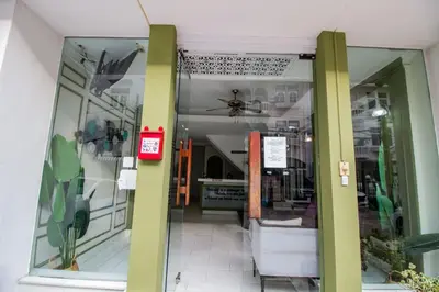 a window of a store with a chair in it at Skutan-MTB Sutthisan in Bangkok