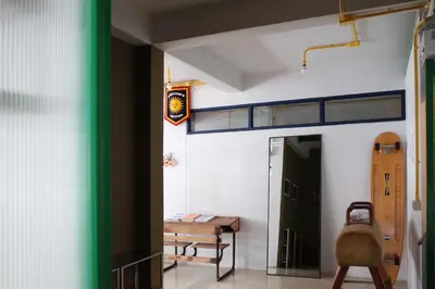 a room with a bunk bed on the wall at The Urbanists BKK Best for groups & long stay near Medpark Hospital , Queen Sirikit Convention hall , Benjakitti Park in Bangkok