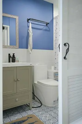 a bathroom with a white toilet and a sink at hiddenmoon cottage in Bangkok
