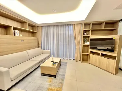 a living room with a couch and a tv at Circle 31 #1BR Bangkok in Bangkok